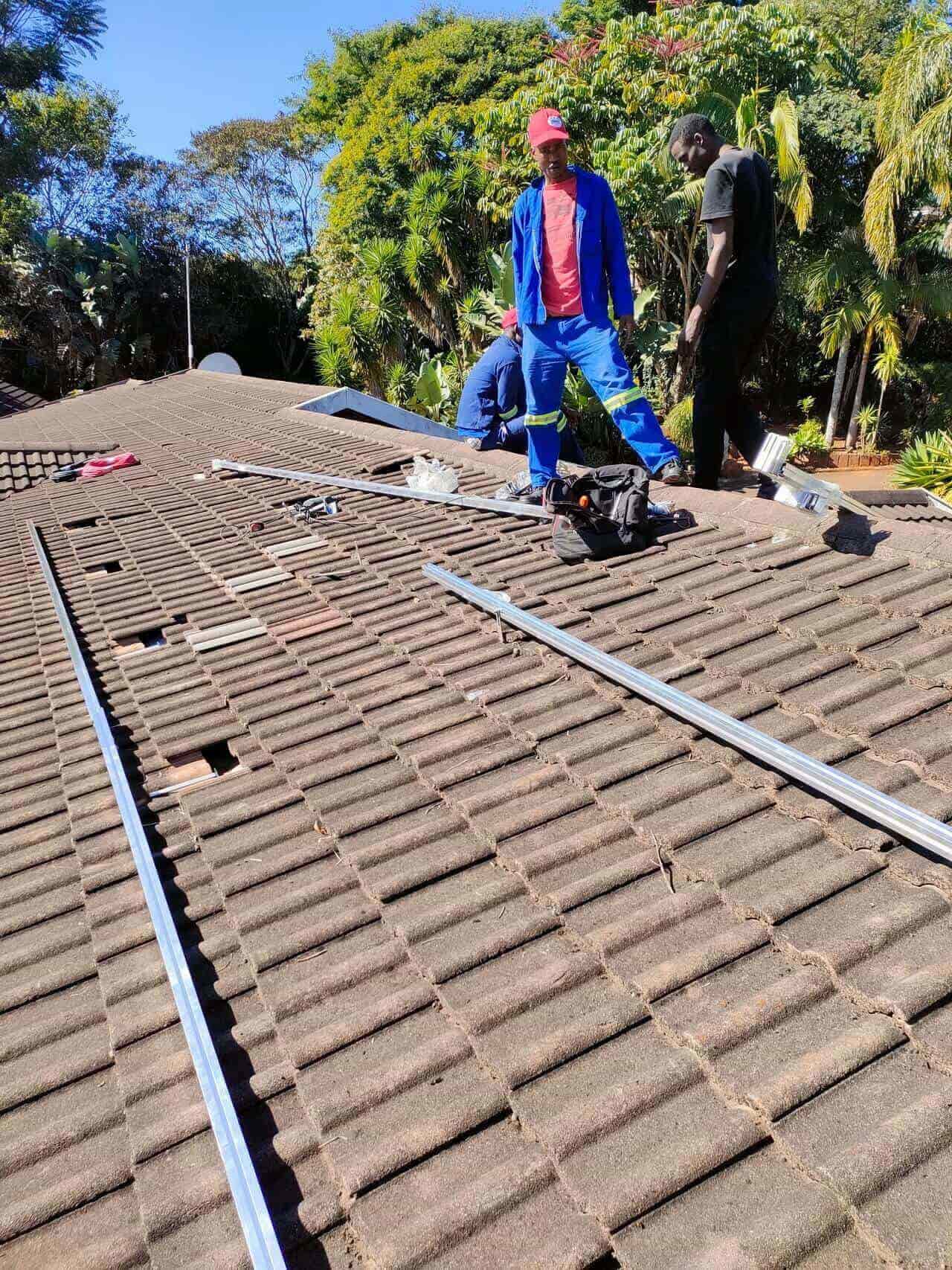 Technicians installing solar panels at a residential property in Durban, South Africa.